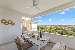 Outdoor dining - Tidal Tranquility - New apartment (Blue Bay Golf & Beach Resort)