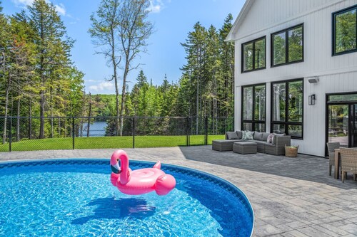 Lakefront Luxury Retreat w Heated Pool Arcade