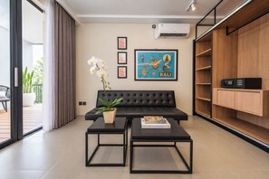 Nomad Apartmen | Living area | 43-inch LED TV with digital channels - TheNomad Canggu (Canggu)