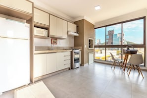 Superior Triple Room, City View | Private kitchen