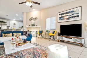 TV, fireplace, books