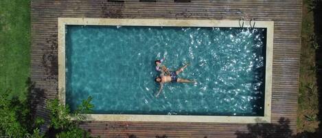 Outdoor pool, open 6:00 AM to 10:00 PM, sun loungers