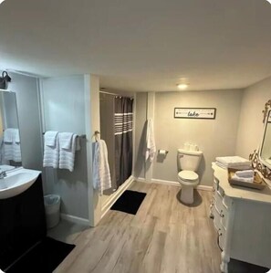 Shower, towels, soap, toilet paper