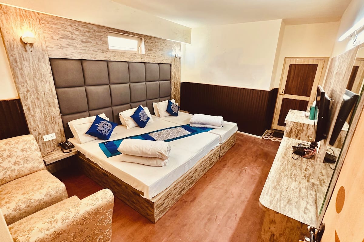 Deluxe Triple Room, Balcony | Desk, laptop workspace, free WiFi