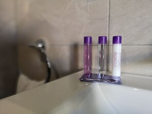 Hair dryer, towels, soap, toilet paper