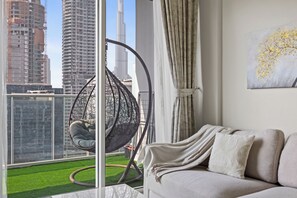 1 Bedroom Apartment - Burj Khalifa View | Living area | 55-inch Smart TV with digital channels - Luxury Apartments in Dubai Business Bay (Dubai)