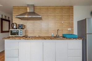 Apartamento, sacada | Cozinha privada