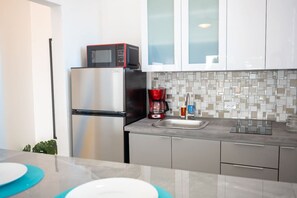 Fridge, microwave, stovetop, coffee/tea maker