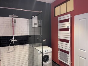 Shower, towels, soap, toilet paper
