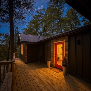 A cabin with a wooden deck, a red door, and a metal roof. - Acorn Drop • 2 Full Baths • Hot Tub • <10 Min RRG (Campton)