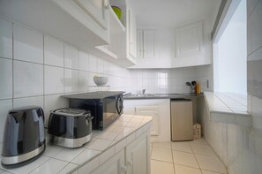 Fridge, microwave, coffee/tea maker, electric kettle