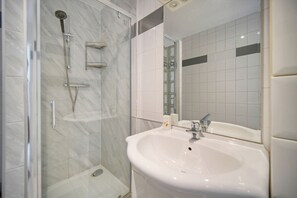Shower, hair dryer, towels, toilet paper
