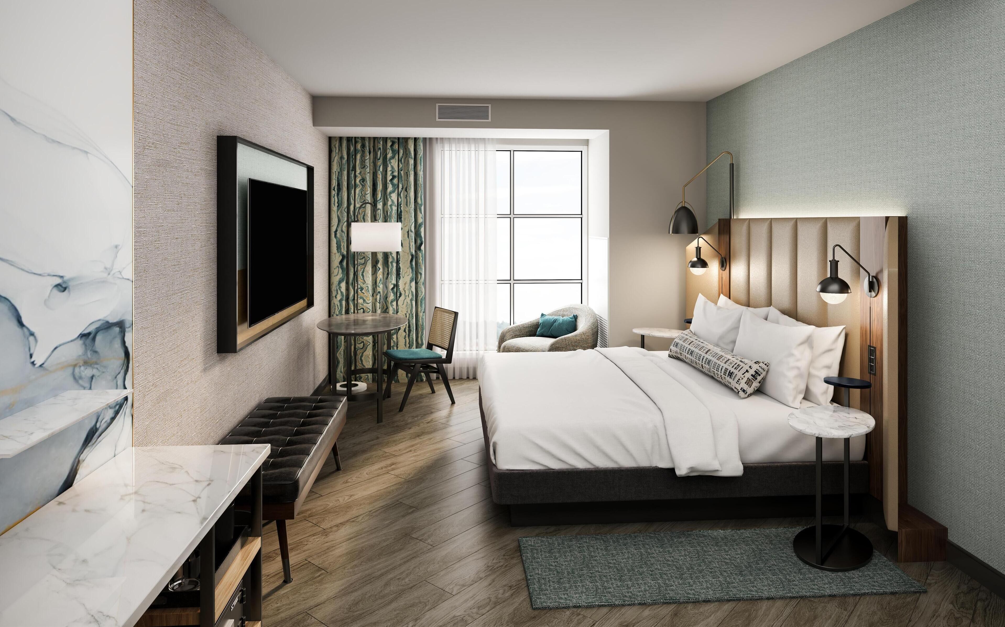 Espacio para trabajar con laptop, cortinas blackout y ropa de cama 