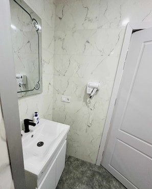 Hair dryer, towels, soap, toilet paper