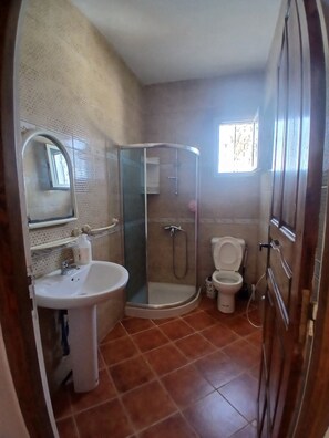 Shower, towels, toilet paper