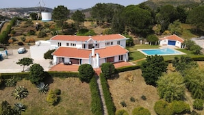 A large, two-story house with a red-tiled roof, a swimming pool, and a well-maintained garden. - Quinta El Molino - Refuge with Swimming Pool in Nature  (Avessada)