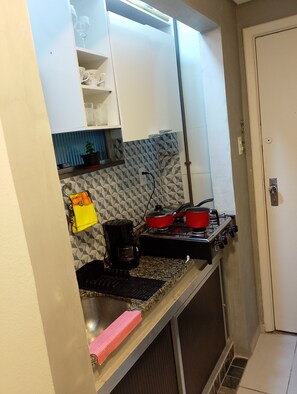 Fridge, microwave, stovetop, coffee/tea maker