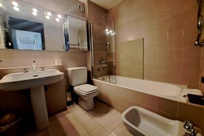 Hair dryer, bidet, towels, toilet paper