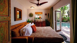 A bedroom with a bed, a ceiling fan, a window, and a view of a swimming pool. - •Hacienda de Amor• Heated pool - Hot Tub - Firepit (Wilton Manors)