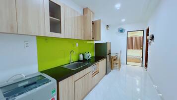 Microwave, stovetop, electric kettle, dining tables