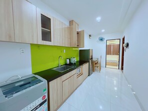 Microwave, stovetop, electric kettle, dining tables