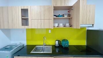 Microwave, stovetop, electric kettle, dining tables