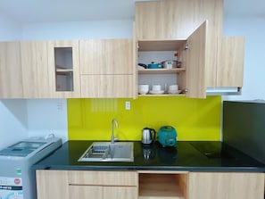 Microwave, stovetop, electric kettle, dining tables
