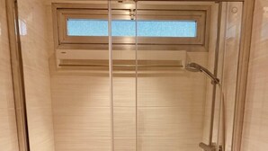 A glass-enclosed shower with a toilet and a sink. - Renovated studios in the center of Cannes an easy walk to the beaches and the Palais des Festivals - 2079 (Cannes)