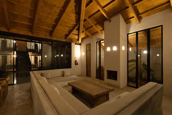 Deluxe Villa, 4 Bedrooms | Living area | Fireplace - Jungla Hotel Boutique (San Cristóbal de las Casas)