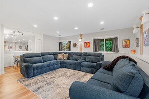 House (2 Bedrooms) | Living area | TV, fireplace, books