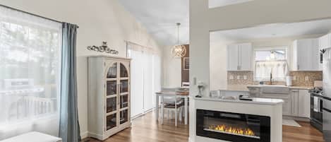 House (2 Bedrooms) | Living area | TV, fireplace, books