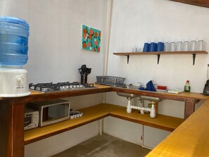 Fridge, microwave, stovetop, coffee/tea maker