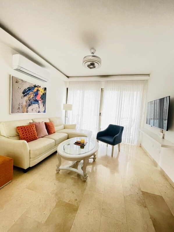 Luxury Apartment, Balcony | Living area | 52-inch Smart TV with digital channels, Netflix, streaming services