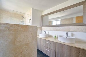Shower, hair dryer, towels, soap
