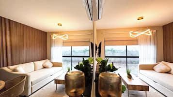 Apartment | Living area | 50-inch flat-screen TV with cable channels