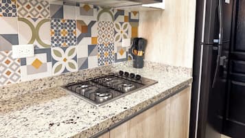Apartment | Private kitchen | Full-sized fridge, microwave, stovetop, coffee/tea maker