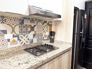 Apartment | Private kitchen | Full-size fridge, microwave, stovetop, coffee/tea maker