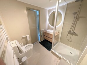 Shower, towels, soap, toilet paper