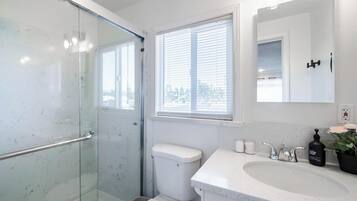 Shower, hair dryer, towels, soap