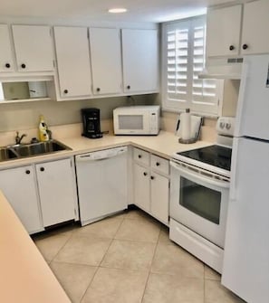 Condo, 1 Queen Bed with Sofa bed, Patio, Pool View (Ocean Club North C104) | Private kitchen | Fridge, microwave, oven, stovetop