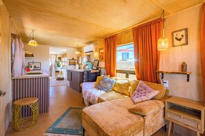 Deluxe Double Room, Roll-in Shower, Patio | Living area