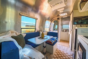 Deluxe Double Room, Patio | In-room dining