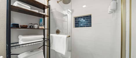 Shower, hair dryer, towels, soap
