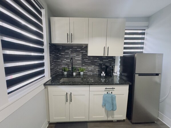 Fridge, microwave, stovetop, coffee/tea maker