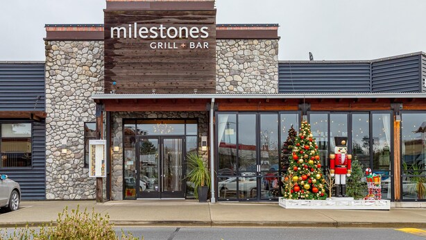 A restaurant named 'Milestones Grill + Bar' with a stone facade and large windows. - Steps from Trails and Village Shops (Highlands)