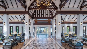 A spacious lobby with a high ceiling, wooden beams, and a patterned floor. - Marriott Vacation Club, Khao Lak Beach Resort (Takua Pa)