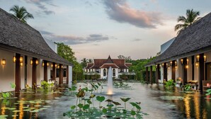 A hotel courtyard with a central fountain, surrounded by water lilies, and two wings with traditional architecture. - Marriott Vacation Club, Khao Lak Beach Resort (Takua Pa)