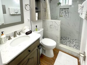 Shower, hair dryer, towels, soap
