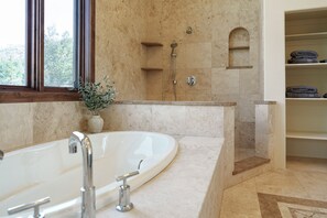 Shower, jetted tub, towels, soap