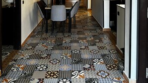 A hallway with a patterned tile floor, a wooden wall, and a ceiling with intricate designs. - Villa with swimming pool not overlooked (Marrakech)